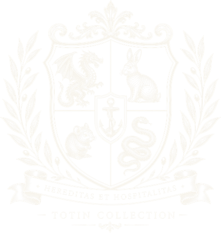 Totin Collection, the family crest: a shield with a dragon, rabbit, mouse and snake around an anchor, within a laurel wreath, above the motto Hereditas et Hospitalitas