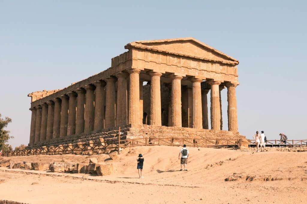 The Temple of Concordia at Agrigento, its Doric columns standing complete against an open sky.