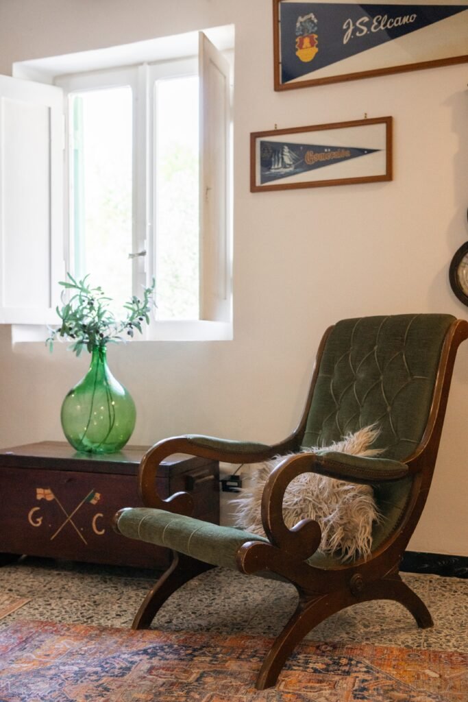 Armchair and glass demijohn, Two Sisters Villa