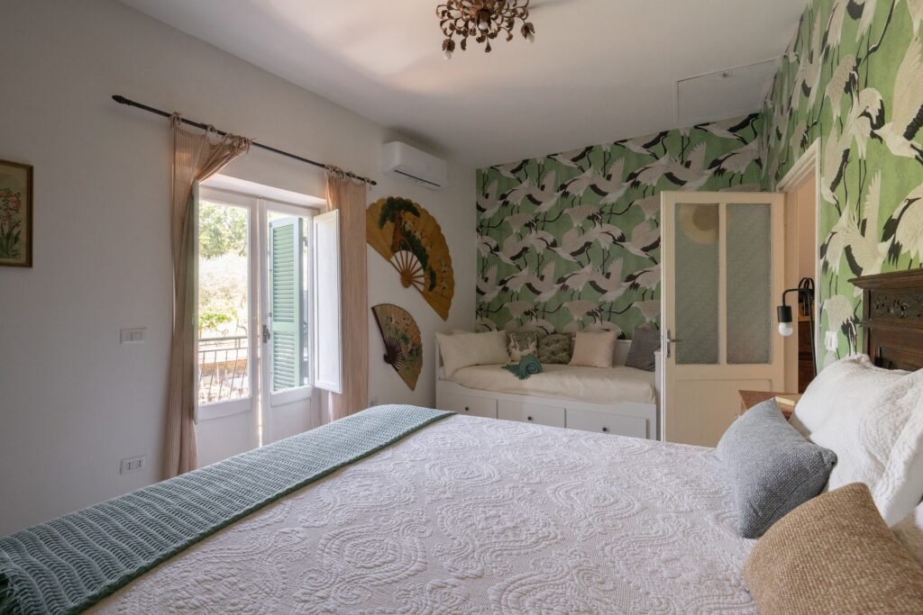 Crane wallpaper bedroom with balcony doors, Two Sisters Villa