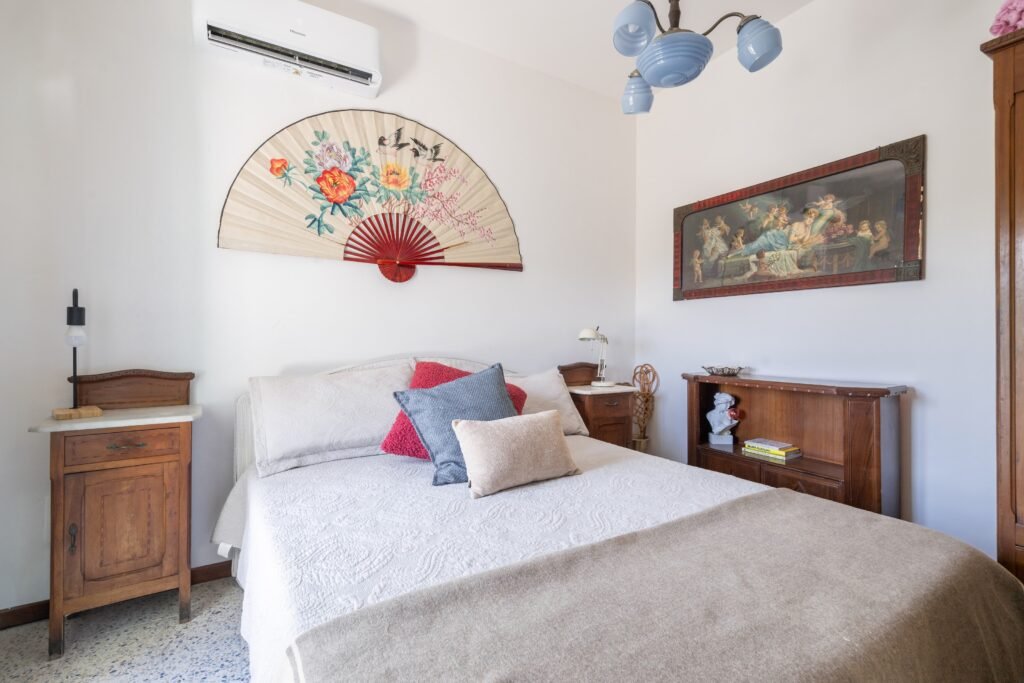 Double bedroom with fan above the bed, Two Sisters Villa