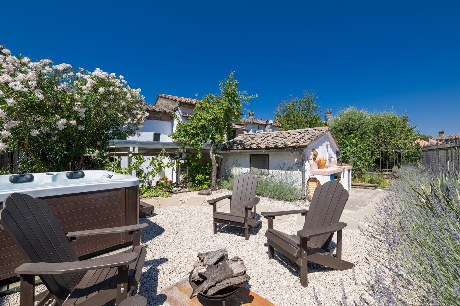 Garden with fire-pit chairs and hot tub, Two Sisters Villa